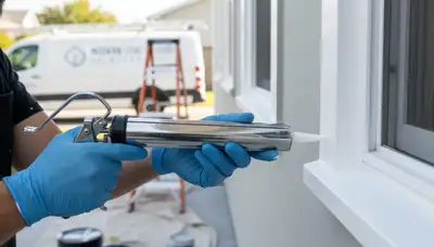 Professional caulking and sealing on home exterior by painters in Allen, TX for weather protection
